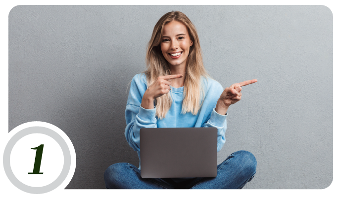 Woman pointing at computer